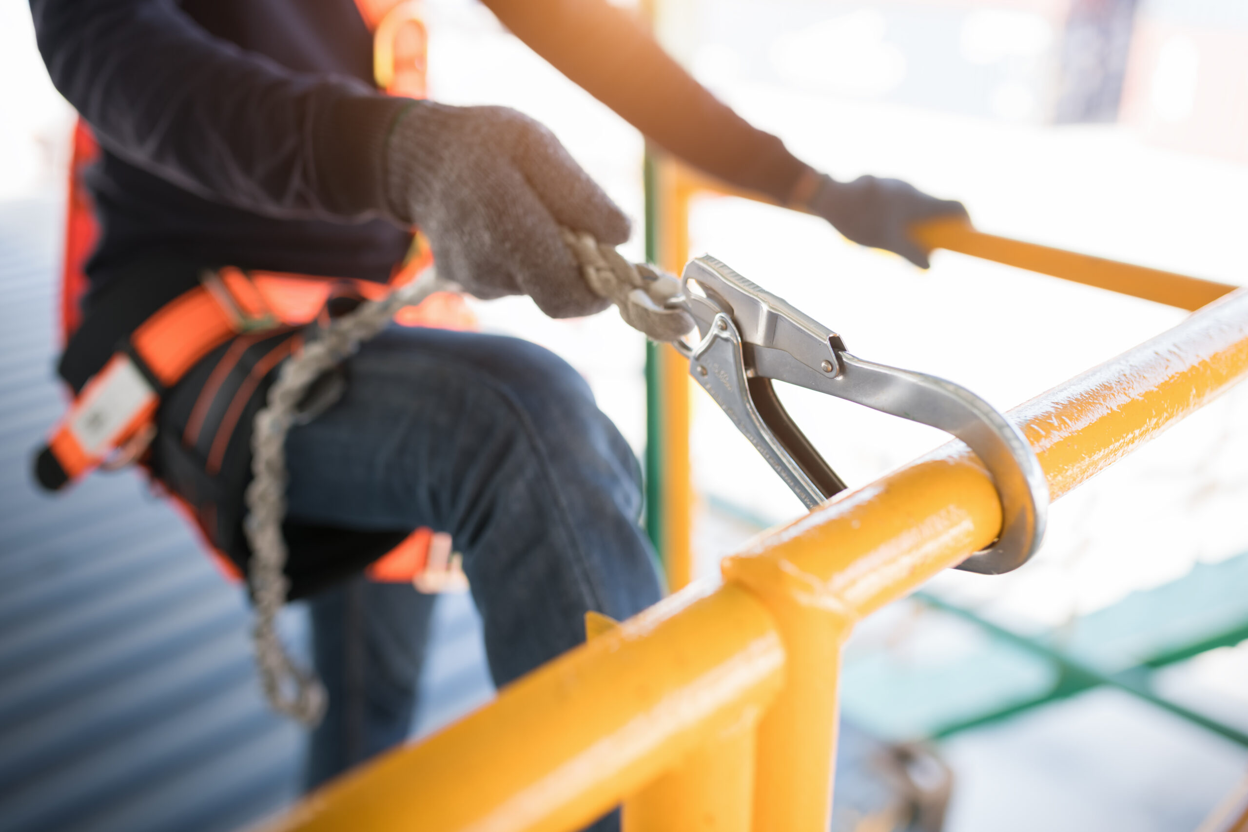Construction,Worker,Wearing,Safety,Harness,And,Safety,Line,Working,At